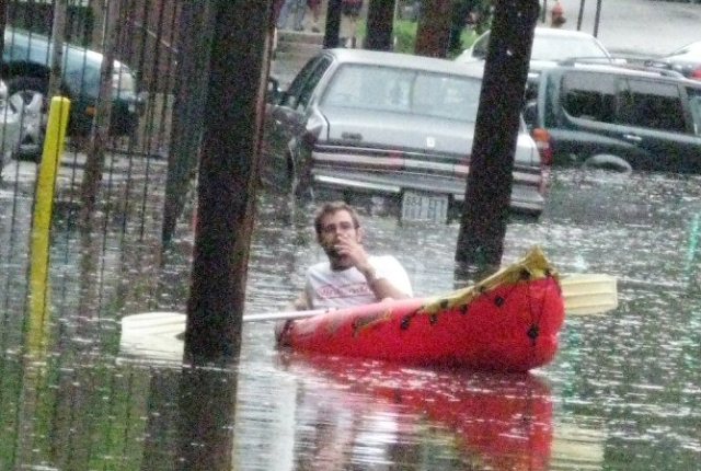 This pic is from a number of years ago when it flooded in my neighborhood.  That man is boating in the middle of the street.  Seemed appropriate.